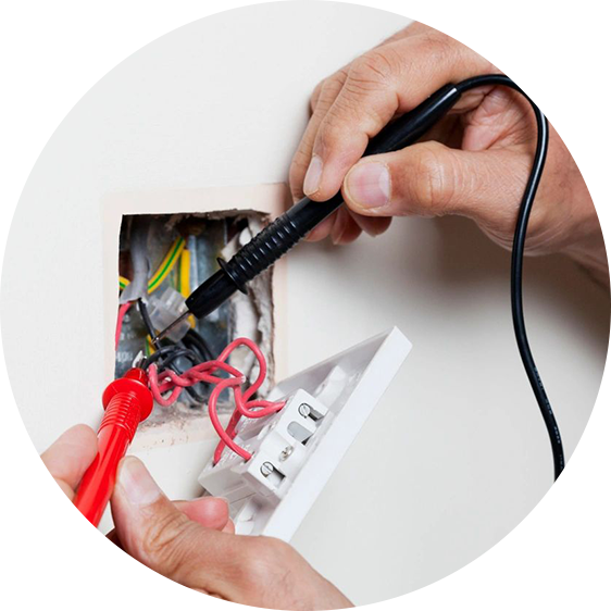 A person is working on an electrical outlet.