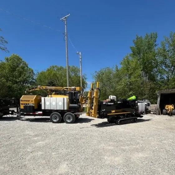 A large truck with a trailer parked in the middle of a lot.